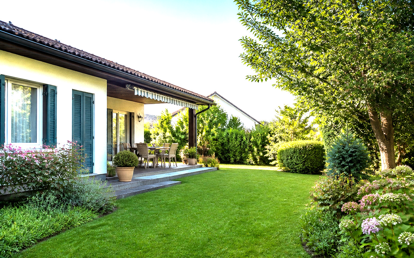 Haus und Garten als helles Symbolbild für pitzelstätten.at